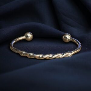 Silver tone twisted torque bracelet